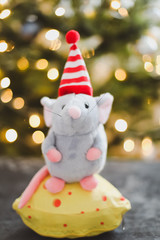 Little mouse toy, symbol of 2020. new year decoration. New Year 2020 Symbol. Greeting Christmas card.  Selective focus.