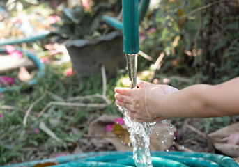 Close up little girl washing her  hand