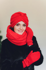 Photo of self assured Arabian lady in hijab, shows you right way, points at blank space with both...