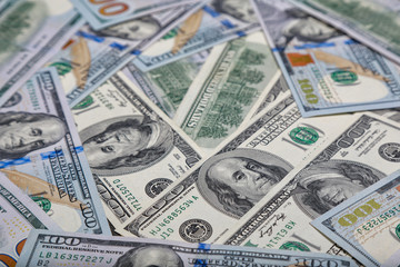different dollar bills as background