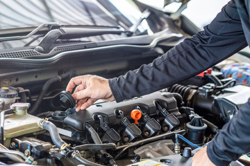 Hand of mechanic man open cap engine oil fill, inspection and  maintenance car service