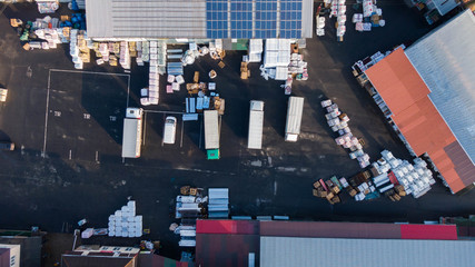 Aerial Shot of Industrial Warehouse Loading Dock where Many Trucks