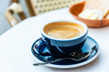 cup of hot coffee on table