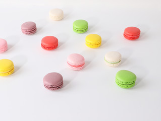 Colored macarons on white background