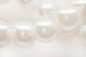 Macro white pearl beads string isolated background