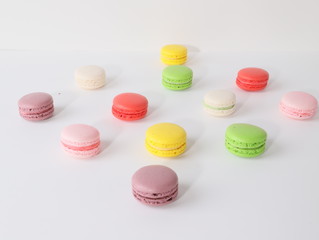 Colored macarons on white background