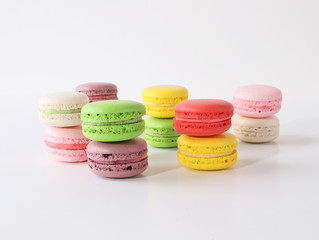 Colored macarons on white background