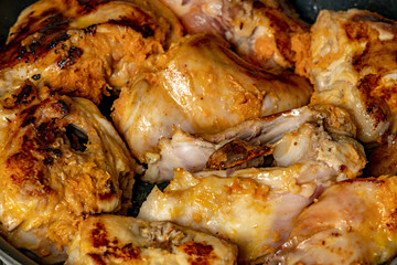 Slices of rabbit stuffed with vegetables in a pan.