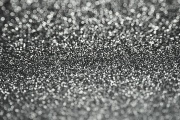 Abstract Sparkle Glitter Lights Background. Black and Dark gray. Shine Bokeh Effect.	