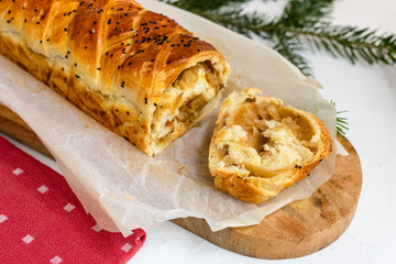 Kulebiak - a dish of Russian cuisine made of yeast dough stuffed with sauerkraut