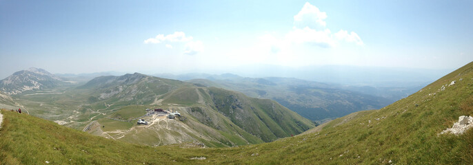 View of mountains and blue sky with clouds	
