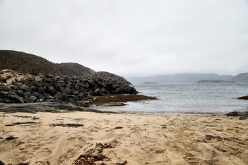 Norway landscape with rocky shore of the Northern sea in cloudy weather
