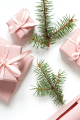 Christmas pink flat lay. Holiday boxes, fir branches on white background. Christmas winter holiday congratulation invitation birthday wedding.Long banner
