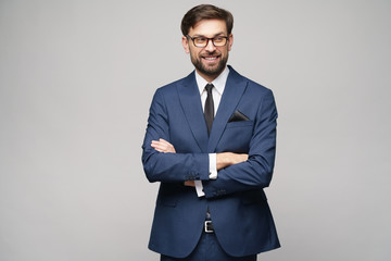 studio photo of young handsome businessman wearing suit
