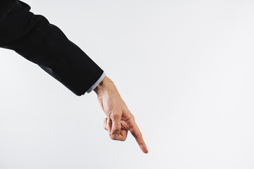Business concept: hand pointing down. Symbol of going down, recession, fall or a boss giving orders...