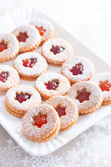 Traditional christmas linzer cookies on a white dish, selective focus