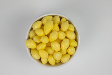 Ginkgo nuts in white bowl  on white background