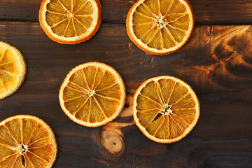 Fototapeta na wymiar Dried orange on a wooden background. Citrus