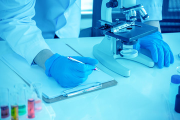 concept of medical, chemicals or scientific laboratory research and Innovation in the laboratory. experienced man scientist is performing work in the laboratory..