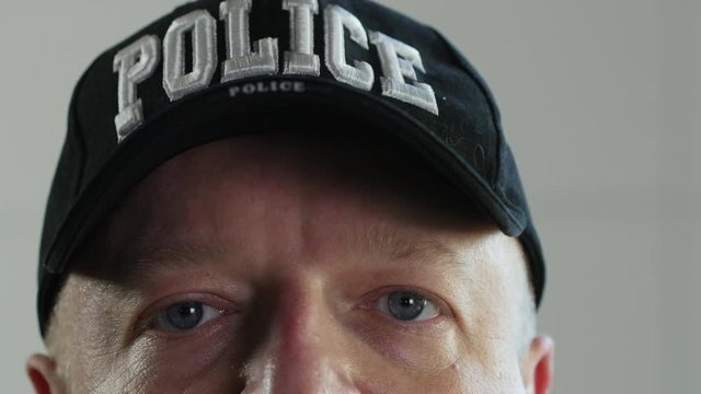 Police officer hat and eyes close up