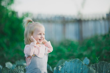 Happy Child Laugh In Cabbage Garden Summertime