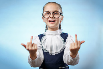 School Girl In Glasses Showing Middle Finger. An insulting gesture. A Bratty Child