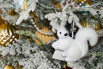 Christmas tree decorations. Christmas toys, squirrel, butterfly, beads and garland, colorful balloons. Christmas.
