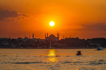Sunset in istanbul, silhouette of the historical peninsula. Sunset over Hagia Sophia.
