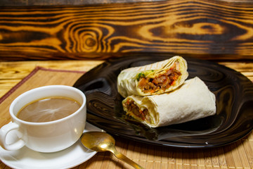 shawarma with meat on the table, selective focus with shallow depth of field, warm vintage filter