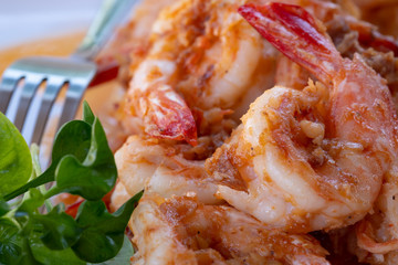 Close up Thai dish. Fresh shrimp stir fry with garlic sauce. Eat together with Thai rice.