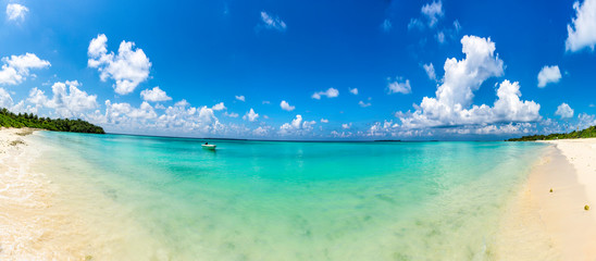 Panoramic View of Amazing Beach Funadhoo Island in Maldives turquoise color Sea with bright blue color sky and clouds Famous Place to travel in the world