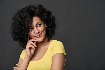 Smiling thinking wooman looking to side