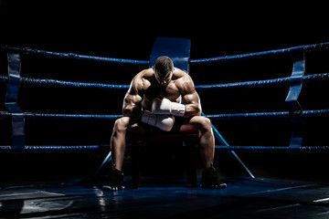punching boxer on boxing ring - 311386982