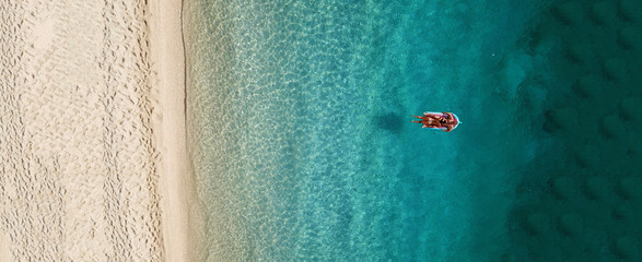 Aerial drone photo of tropical exotic destination island in Thailand with deep blue turquoise sea and beautiful landscape