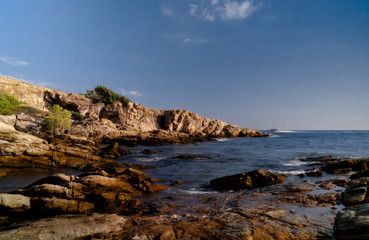 Fototapeta na wymiar Afternoon sea view, rocks, boat in the island 