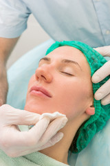 Fototapeta na wymiar Procedure for cleaning the skin of the face sponge