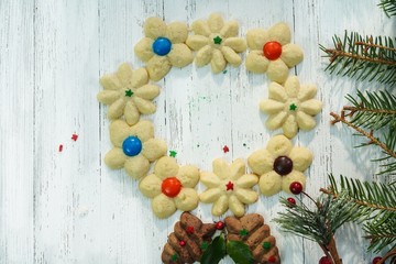Fototapeta na wymiar Homemade assorted X'mas spritz sugar cookies on festive holiday white background