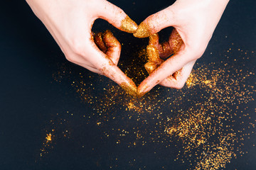 Female hand showing heart shape gesture