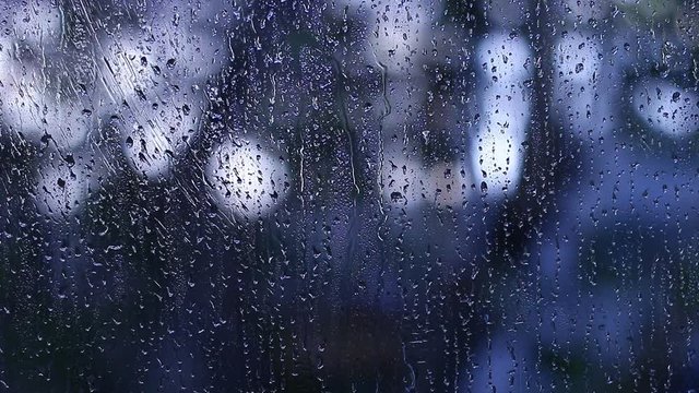 Rain drops on window glass. Sadly, atmosphere background. 