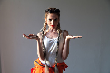 Portrait of a beautiful fashionable woman mechanic of the auto shop