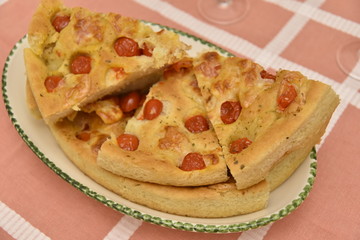 Pizza in the Plate on the Table