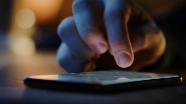Touch Screen Smartphone Lying on the Table while Person is Typing a Message. Concept of Email Writing, Chatting in Social Media Apps, Sending an SMS, Taking Note. Close-up Macro View