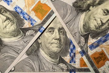 100 dollars bills close-up and portrait of Benjamin Franklin on US cash bill