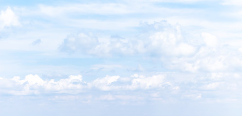 Pastel soft banner with summer blue sky and white clouds. Natural background. Heaven, paradise and hope metaphor.