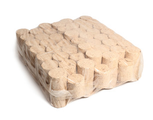 Wood briquette. Isolated on a white background.