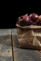 onions in the basket, the onion is white, .onion wooden background