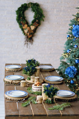 Beautiful New Year's interior in rustic style. Table decoration for the New Year holiday.