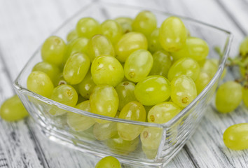 Portion of healthy White Grapes (selective focus; close-up shot)
