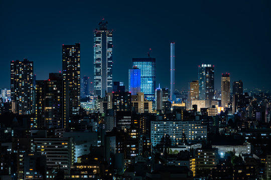 Fototapeta Tokyo city buildings night view and sky
