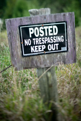 Weathered No Trespassing Sign